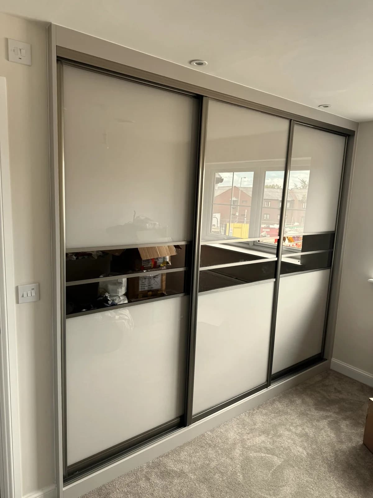 Contemporary Sliding Wardrobe with Black Glass Accents