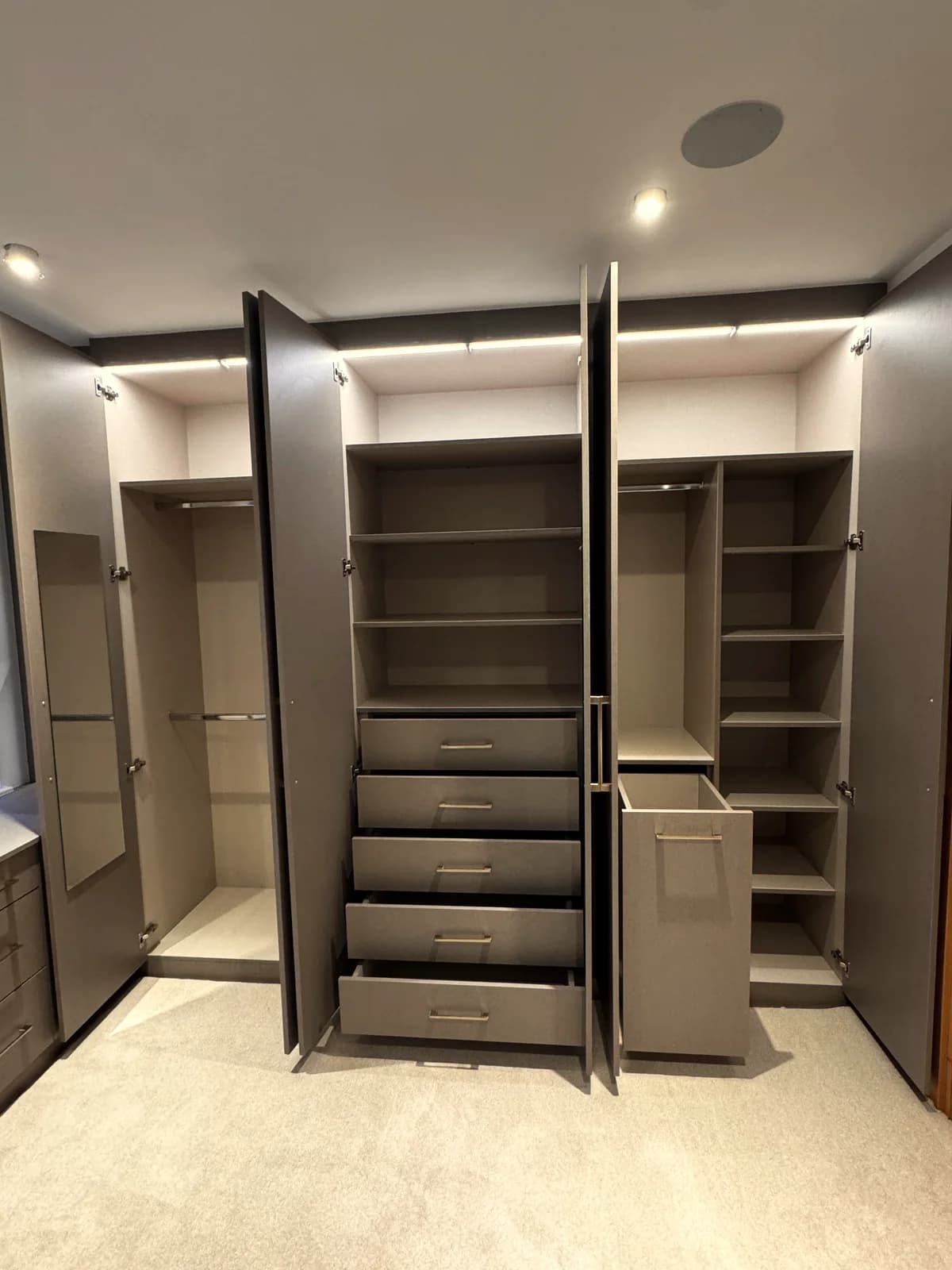 Cabinet maker hand-finishing a fitted wardrobe joint