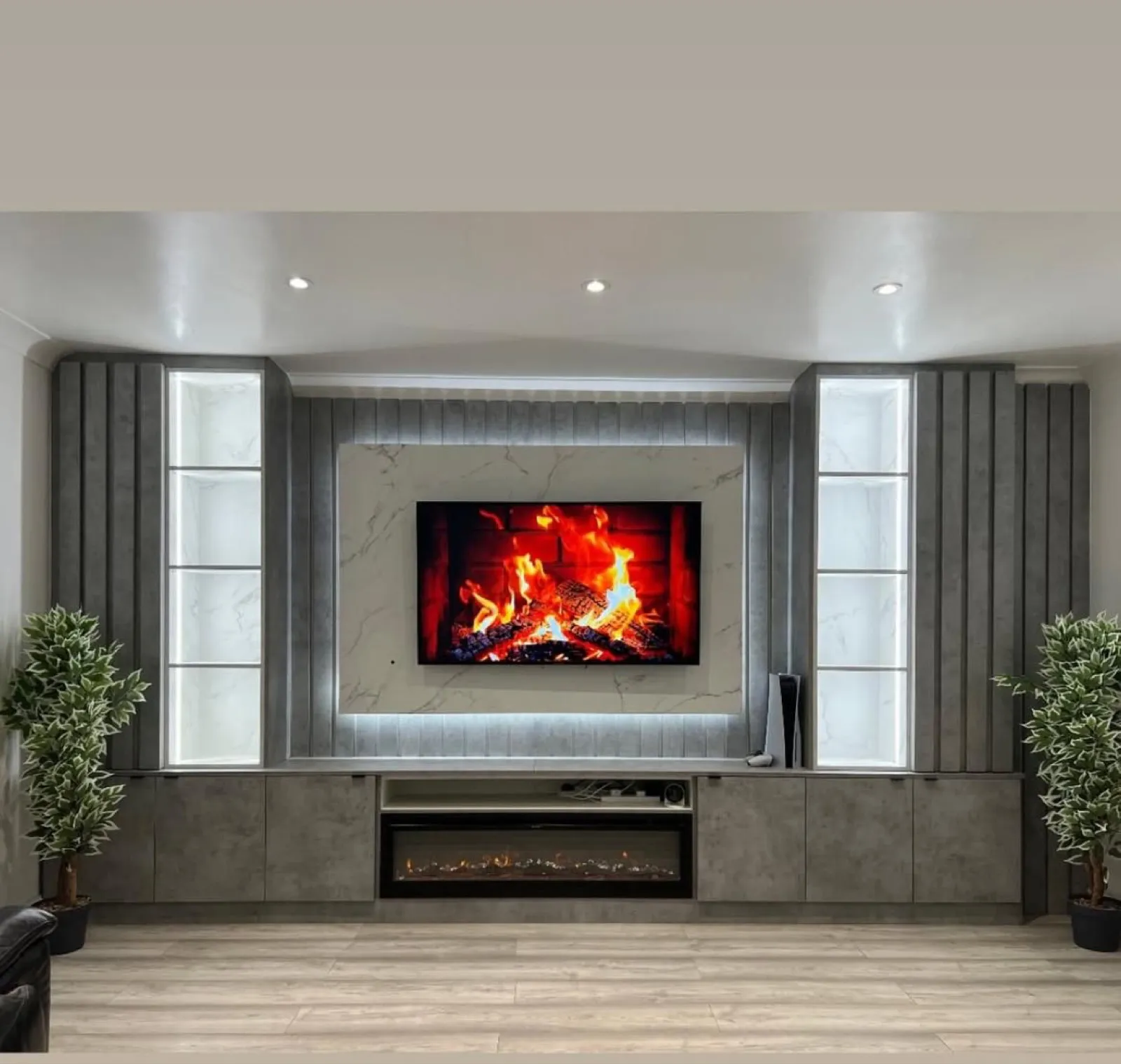 Grey Media Wall with Fireplace and Plants